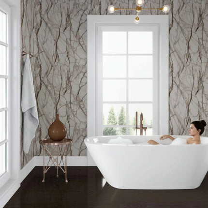 Bathroom with a freestanding bathtub, gray shower curtain, and decorative elements.