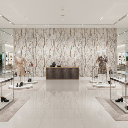 Modern interior design with marble wall and display shelves.
