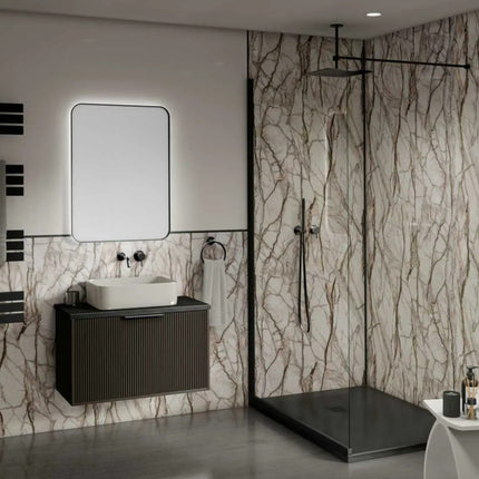 Modern bathroom with marble walls, a sink, and a shower area.