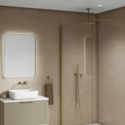 Beige Stone Maxi Panel Wall Panel installed in a Modern bathroom, a shower, sink, and mirror are aso in the room.
