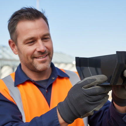 Builder Holding Black Square Internal Stop End, Floplast Brand and admiring it
