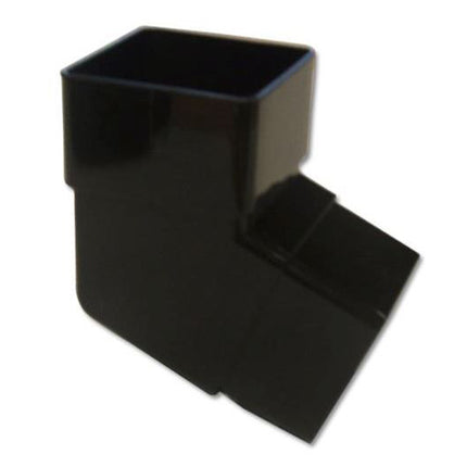 Black plastic fitting on a white background