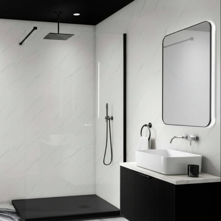 Modern bathroom with black and white color scheme, featuring a shower area and vanity.