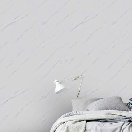Bedroom with a Carrera Marble Matt Maxi Panel Wall Panel and a lamp