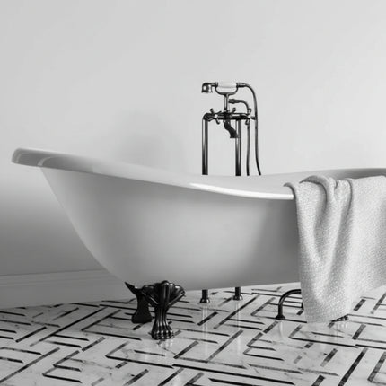 White freestanding bathtub with black faucet in a bathroom setting with gloss white maxi panel wall panels installed