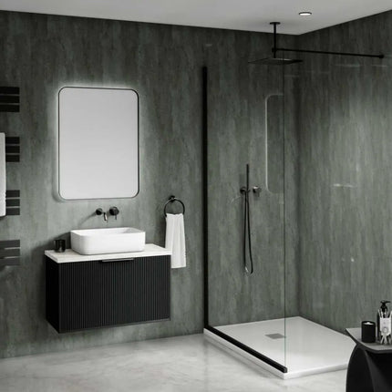 Modern bathroom with gray walls, a sink, mirror, and shower area.