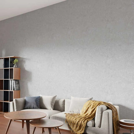 Misty Stone PVC Maxi Panel Wall Panel applied to a wall with a gray sofa and wooden coffee table.