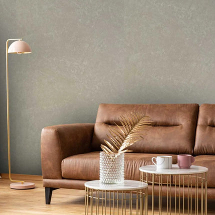 Truffle Stone Maxi Panel Wall Panel in a Modern living room with brown leather sofa, gold floor lamp, and decorative items.