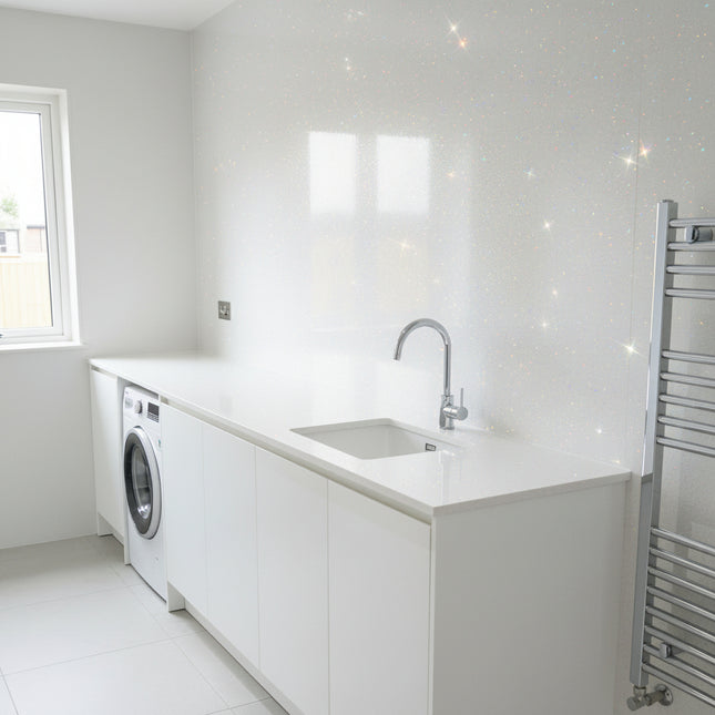 White sparkle wall panels in a Modern laundry room with white cabinets, washing machine, and sink.